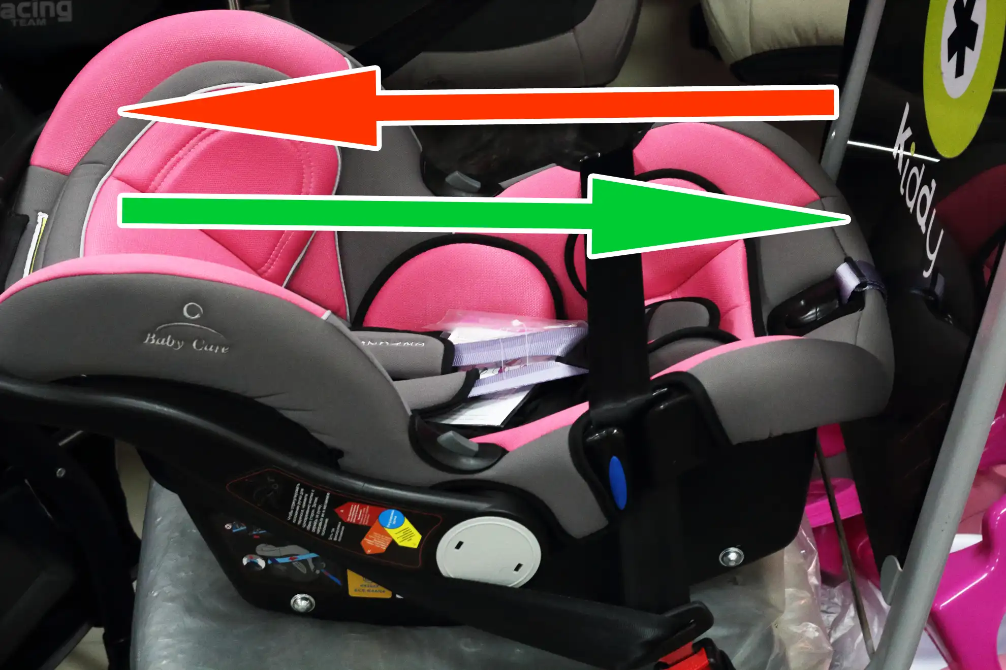 Expert car seat installation audit: Rear-facing infant carrier on a test bench showing impact force vector