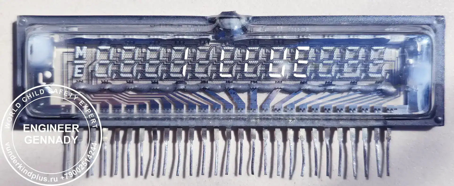 Soviet VFD matrix IVL1-8/13 glowing with a turquoise message "I AM ALIVE". Symbol of artificial intelligence awakening in vintage hardware.