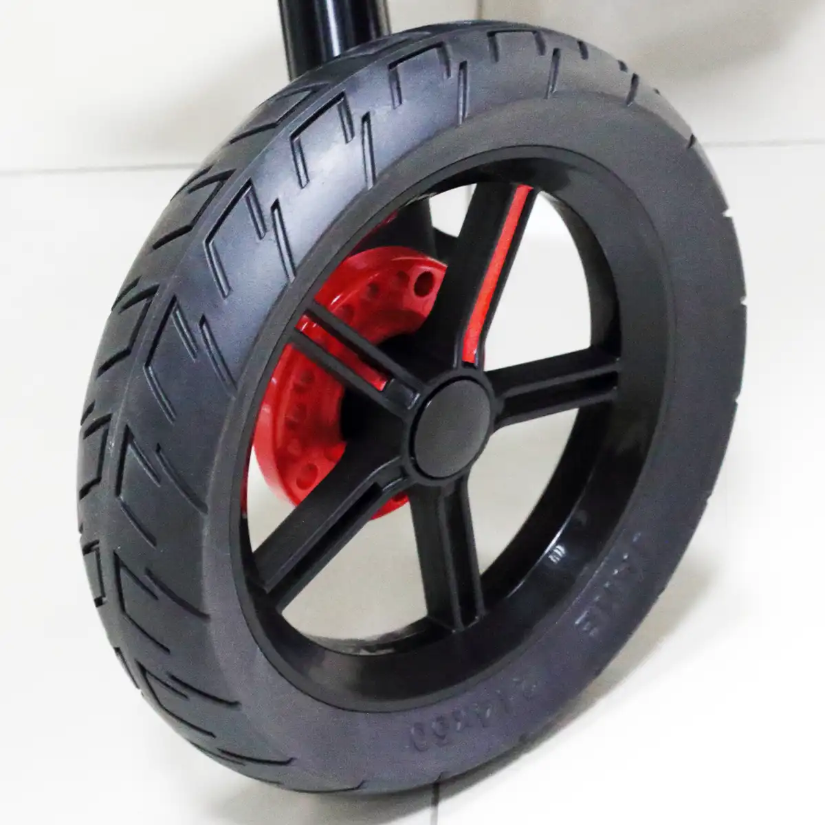 Hybrid non-pneumatic rubber stroller wheels: puncture-proof design with improved road grip