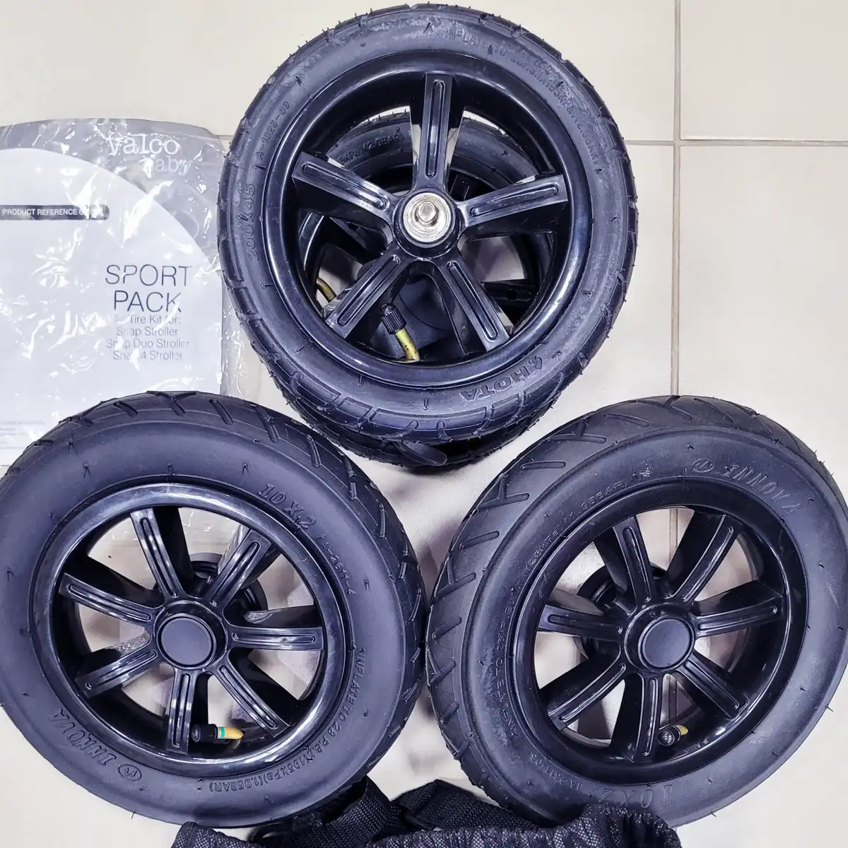 Replacement set of pneumatic air-filled wheels compared to original plastic EVA wheels for better shock absorption